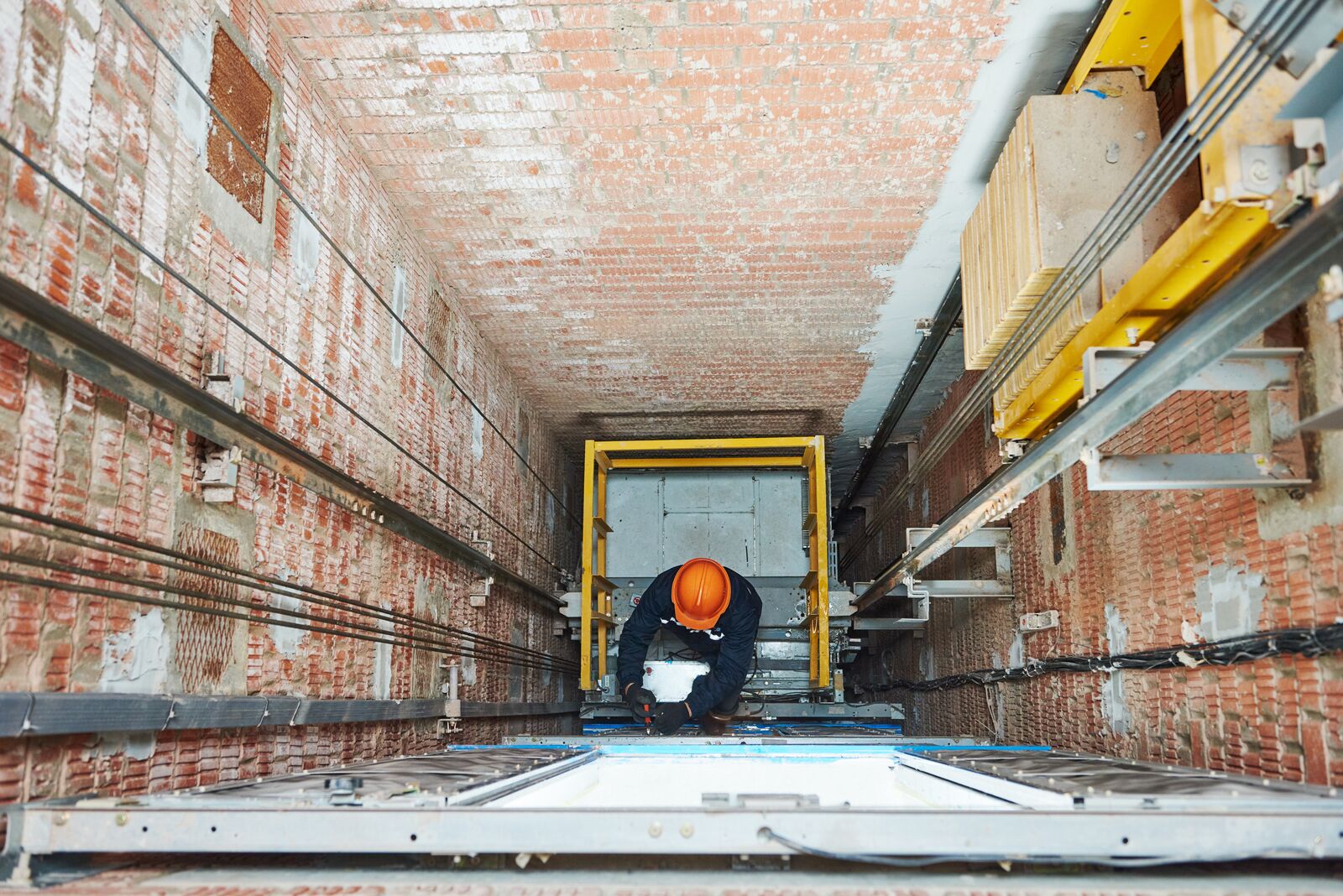Professional Technician Checking Elevator in a Building