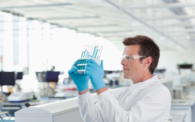 Scientist Examining Test Tubes in Laboratory