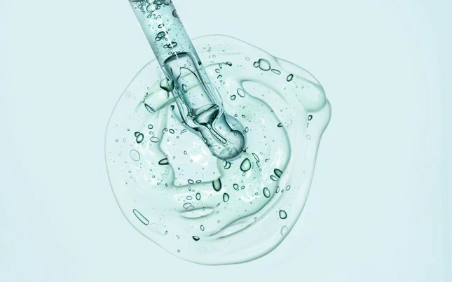 Serum Being Analysed wit a Microscope