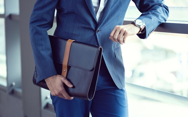 Businessman Carrying Leather Bag