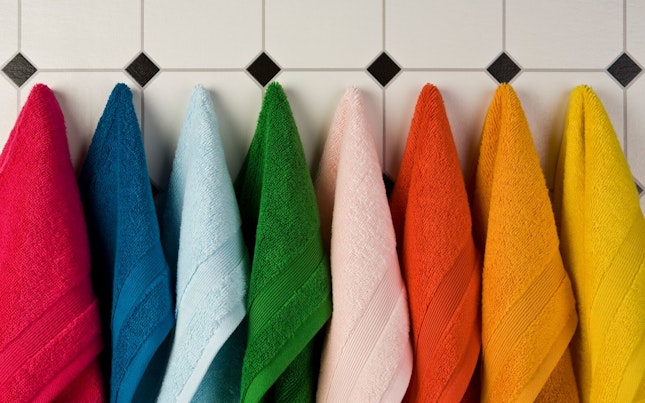 Set of Multi-Colored Towels Hanging on a Wall