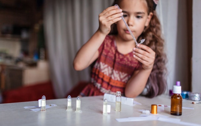 Little Girl Playing with Perfume Do it Yourself Kit