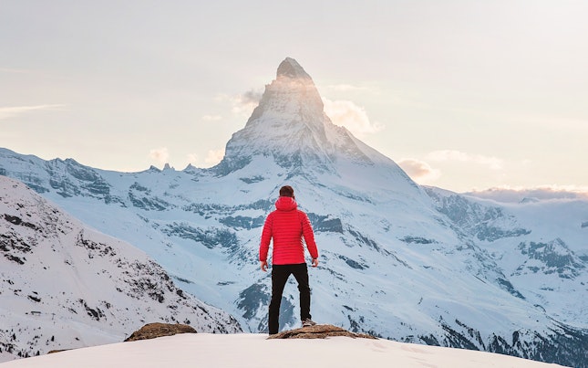 Man Standing in Front of Matterhorn