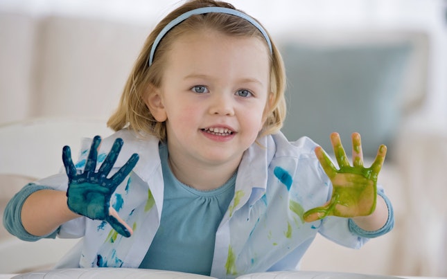 Little Girl Doing Hand Painting