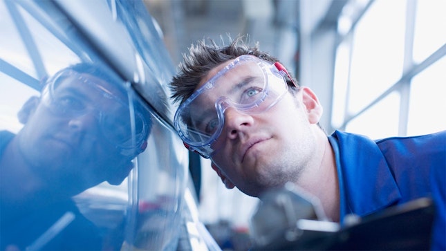 Technician Doing a Car Inspection