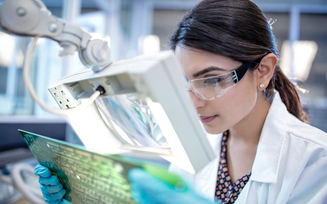 Man Holding External Battery and Smartphone