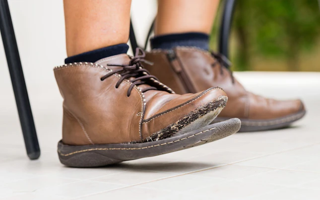 Torn Leather Shoe