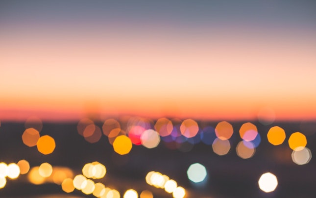 Man Holding External Battery and Smartphone