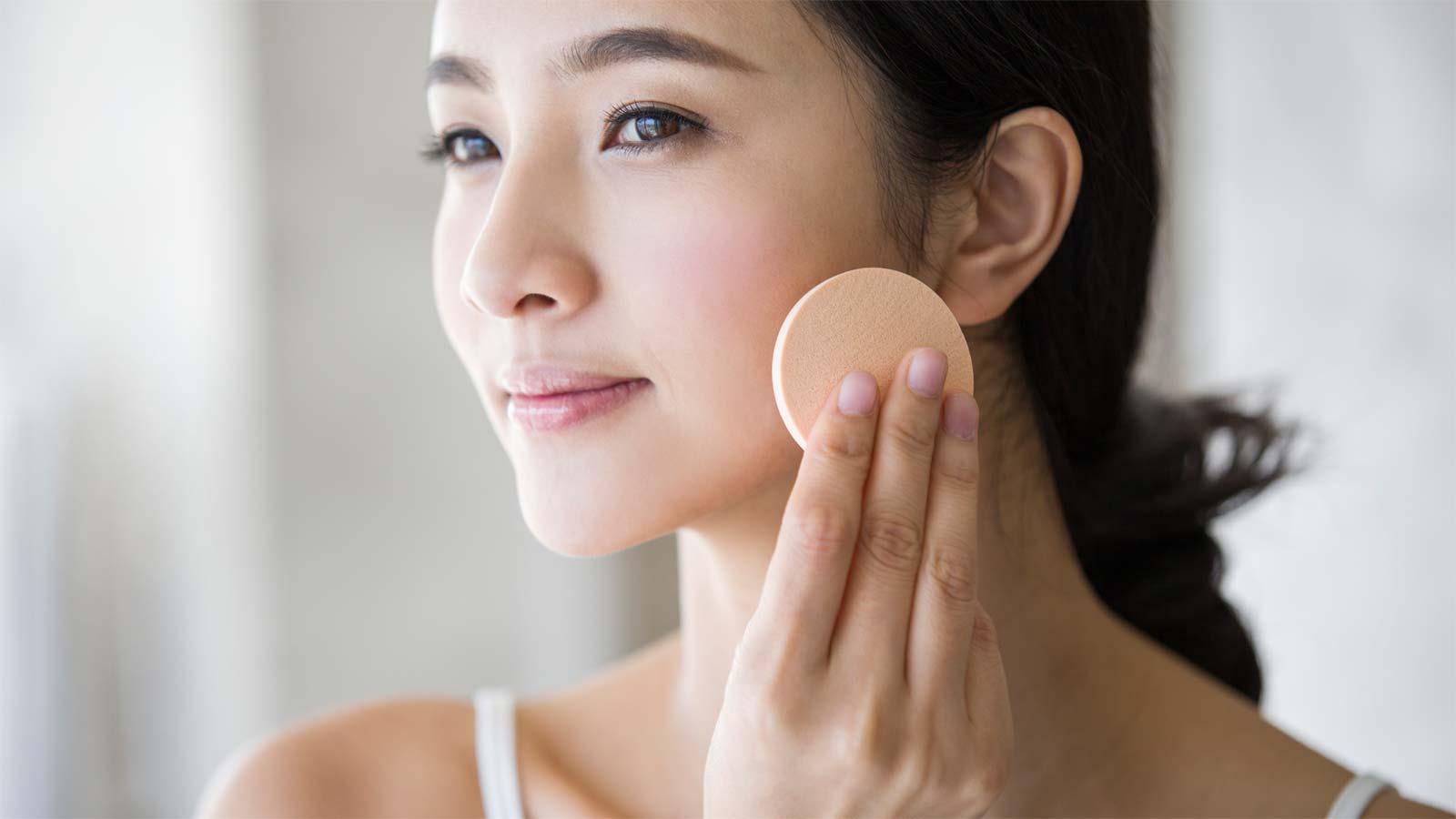 Woman applying powder