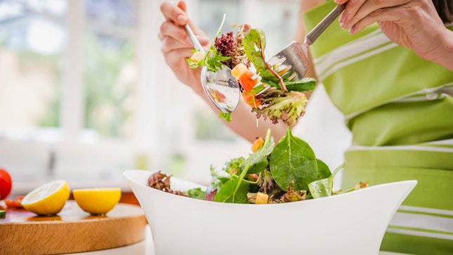 Woman eating salad