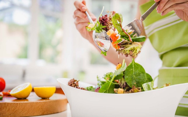 Woman eating salad