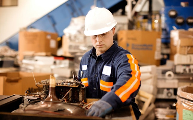 Man Holding External Battery and Smartphone