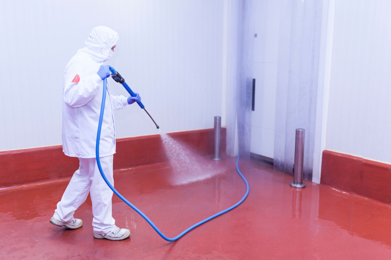 Worker Cleaning  Floor in Food Plant