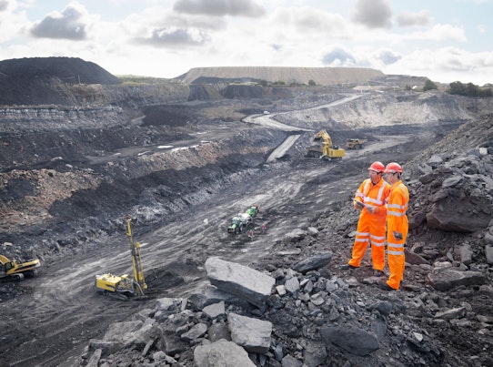Workers Looking over Coal Mine