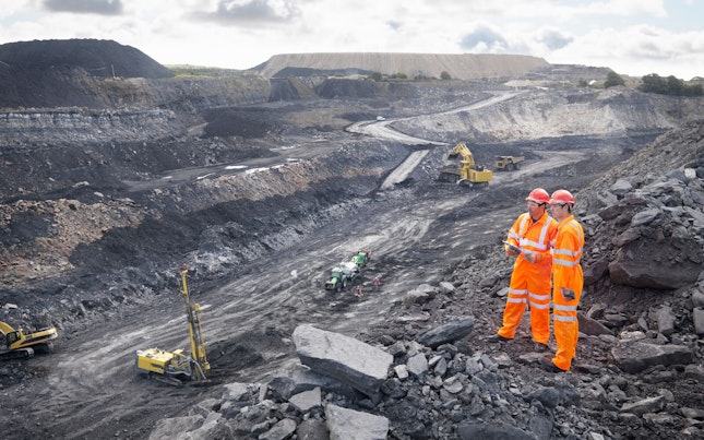 Workers Looking over Coal Mine