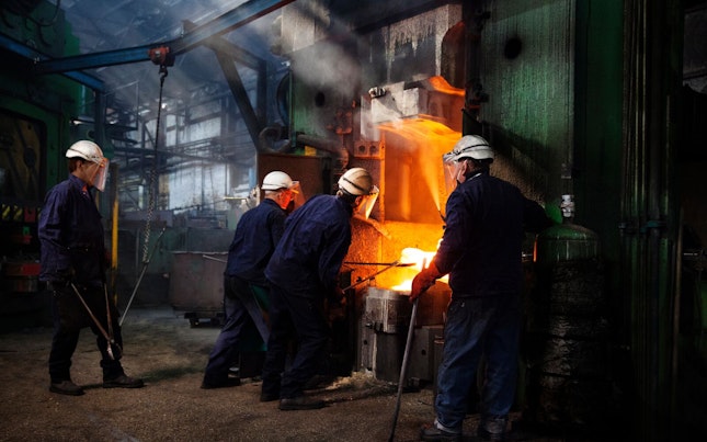 Man Holding External Battery and Smartphone